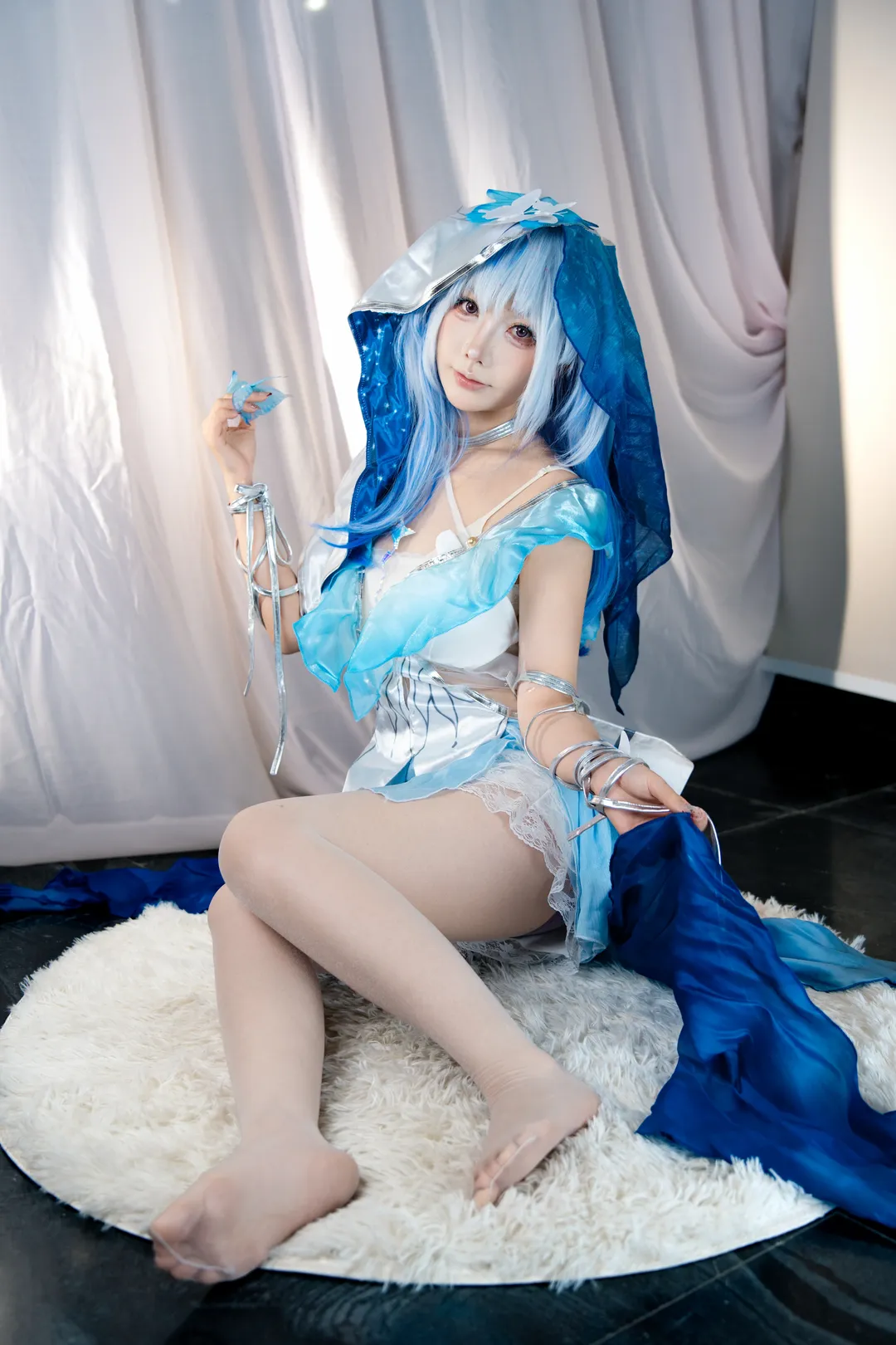 Anime-style photography, The Shorekeeper cosplay, Studio portrait, Blue and white ethereal outfit, Atmospheric styling - Image 1